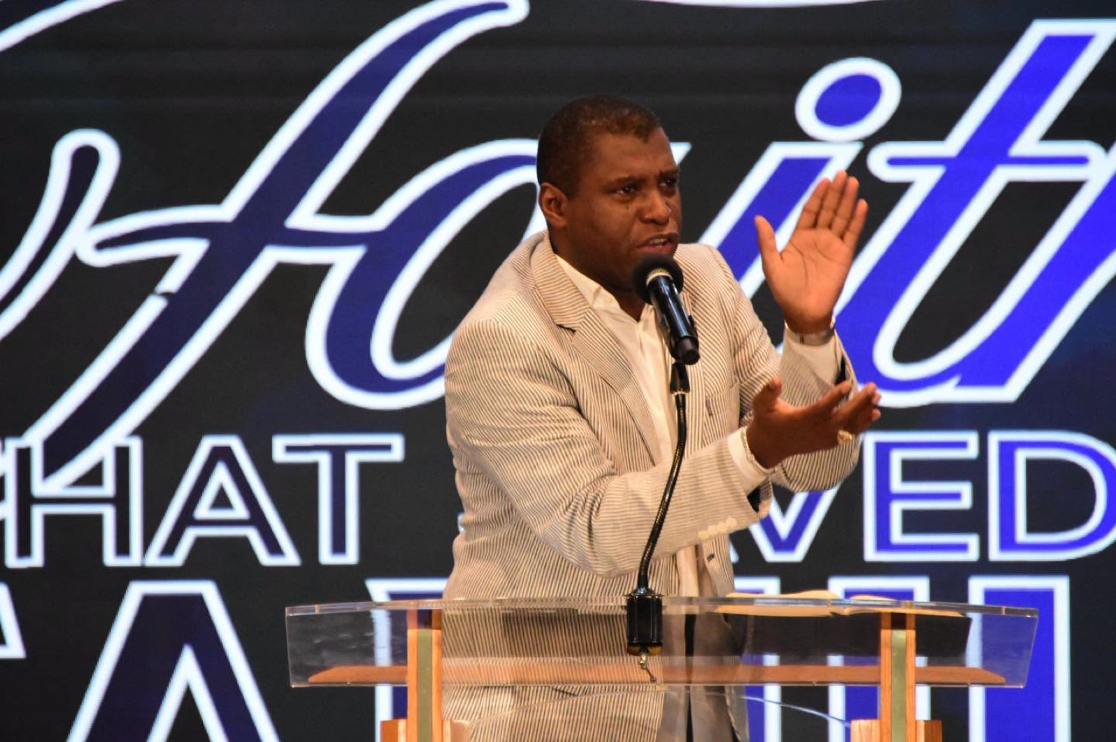 Bishop H. Curtis Douglas preaching from the pulpit.