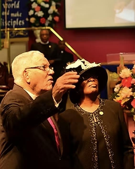 Overseer Stanley Kidd and Rev. Lenore Kidd together at the altar during a celebration service.